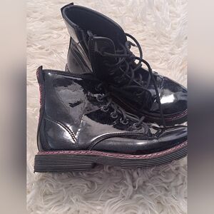 black patent-finish combat-style boot With a subtle glitter Effect & Pink Stitch